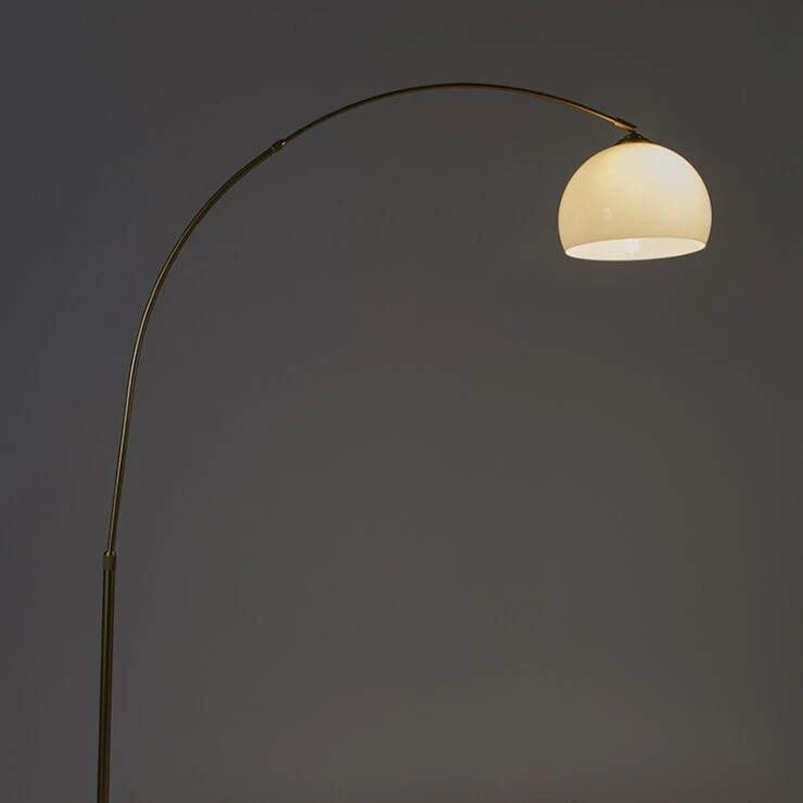 Lampadaire à arc moderne en laiton avec abat-jour transparent
